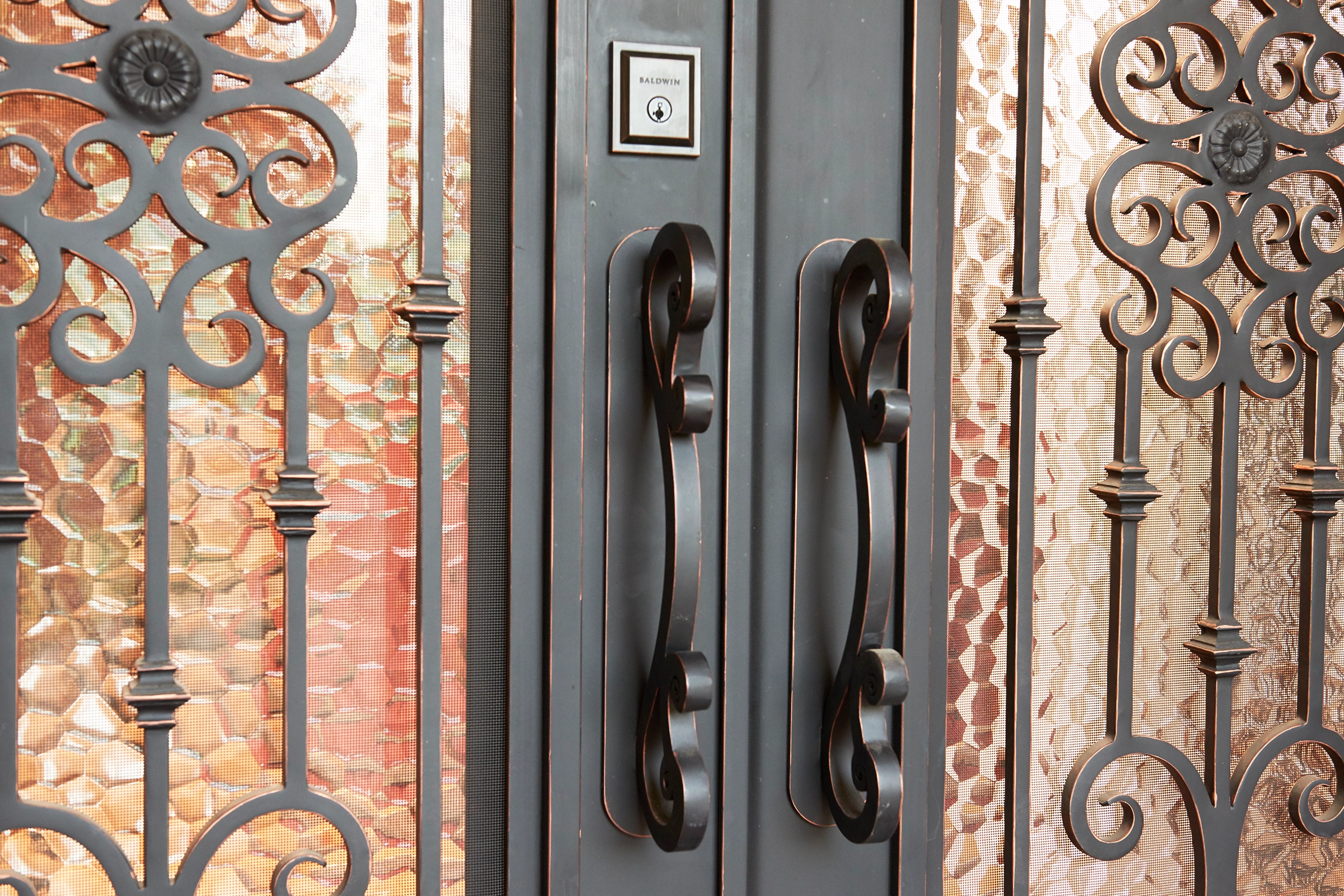 Decorative iron door handles and ornate design